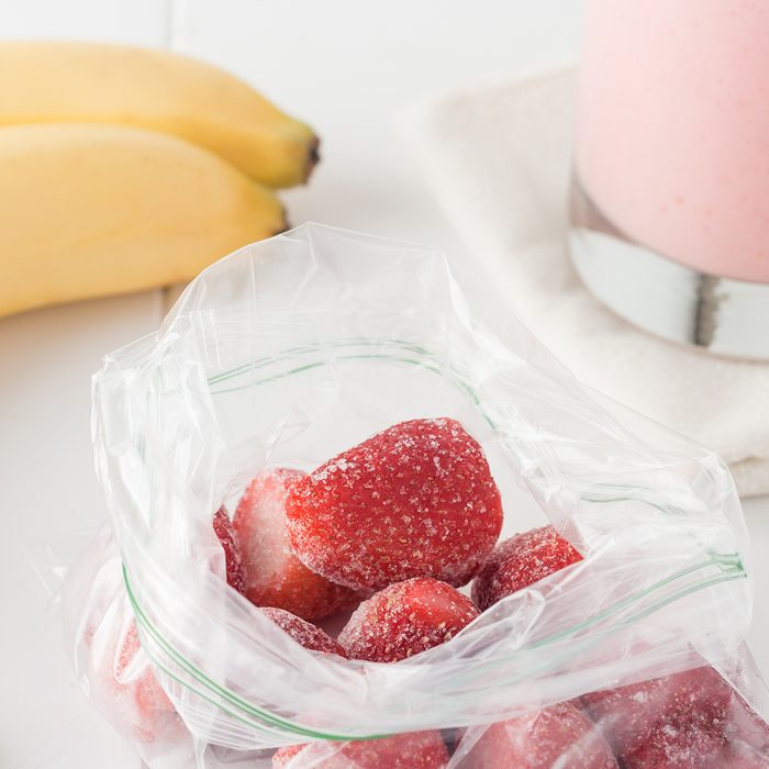 smoothie ingredient: frozen strawberries in clear plastic bag