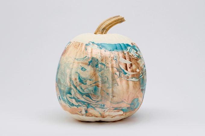 marbled painted pumpkin with blue and gold swirls