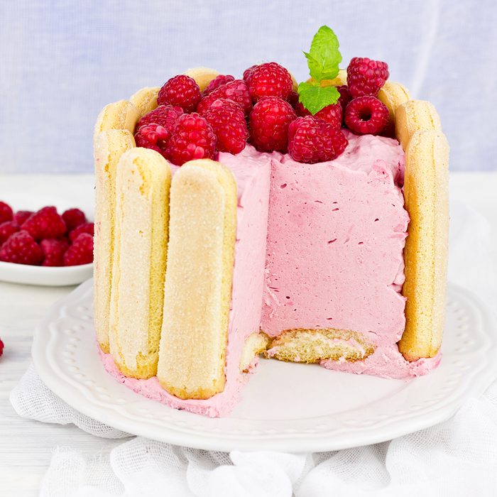 Cake "Charlotte Russ" with raspberries and cream, selective focus.