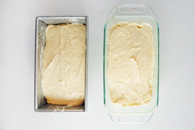 two loaf pans with cake batter before baking