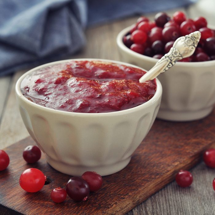 Cranberry sauce in ceramic bowl with fresh berry on wooden background; Shutterstock ID 166304078; Job (TFH, TOH, RD, BNB, CWM, CM): TOH