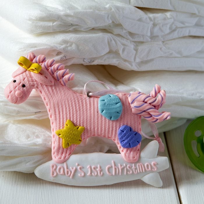 diapers, Christmas toy horse , nipple on a light background
