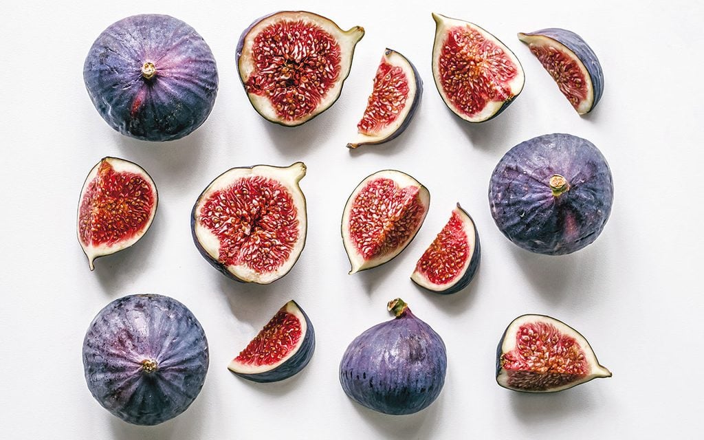 sliced figs on a white background