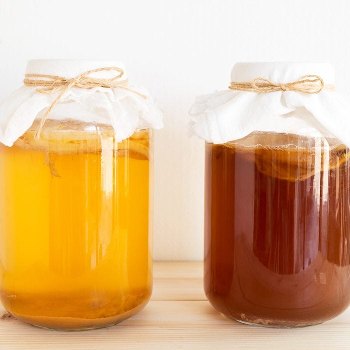 fermented drink, jun tea healthy natural probiotic in a glass jar.