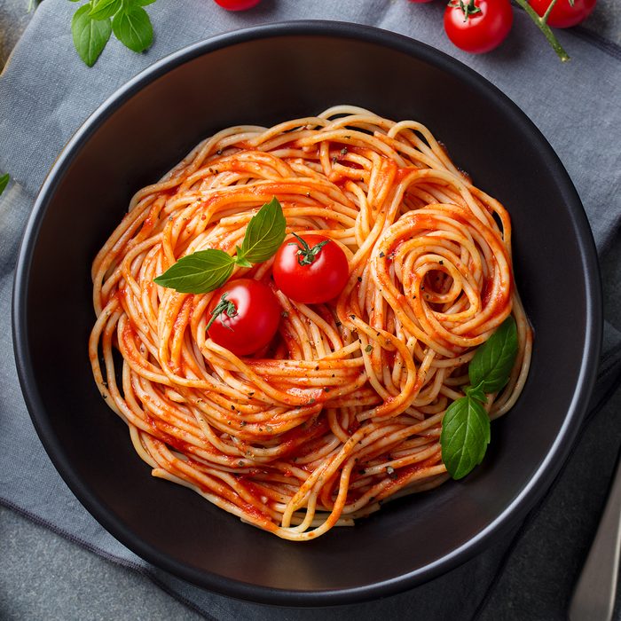Pasta, spaghetti with tomato sauce in black bowl on grey stone background. Top view.; Shutterstock ID 1168833847; Job (TFH, TOH, RD, BNB, CWM, CM): Taste of Home