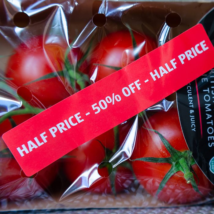Stone, Staffordshire / UK - July 1 2019: Pack of British Regal Vine Tomatoes with discount label from ALDI supermarket. Short dated vegetables on clearance are with label: "Half price, 50% off"; Shutterstock ID 1439340539; Job (TFH, TOH, RD, BNB, CWM, CM): TOH