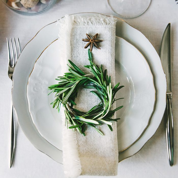 Decorative green wreath on a napkin as a part of table appointment