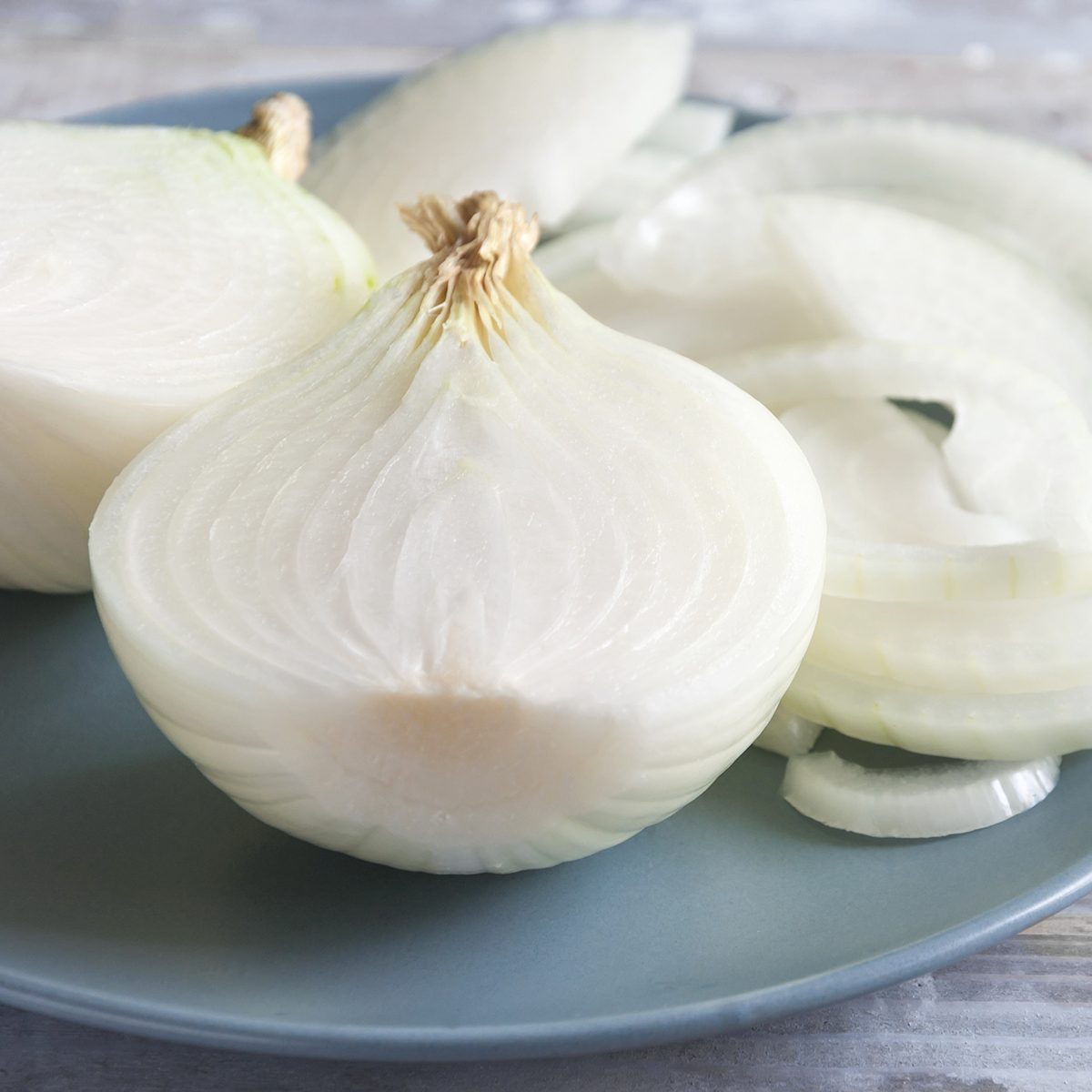 White onion on a wooden rustic table. Organic vegetables. Close-up of sliced raw organic white onion on a plate.; Shutterstock ID 681266095; Job (TFH, TOH, RD, BNB, CWM, CM): TOH