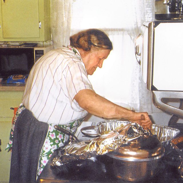 old polish woman prepares thanksgiving dinner 