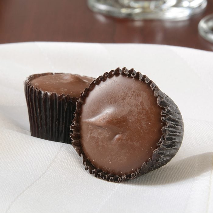 Small peanut butter cups on a white napkin