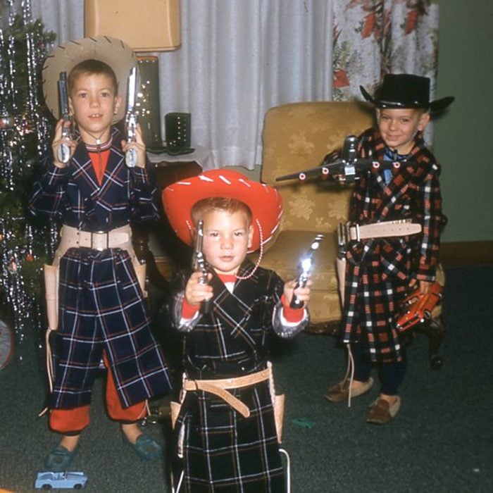 Dec.25 1959 _ Christmas morning with my brothers Joe & Jeff with their 6 shooters and I am armed with a jet and a car to round out the unbeatable posse . pic was taken in Columbus Ohio at our childhood home where I lived at till I was 11 years old.