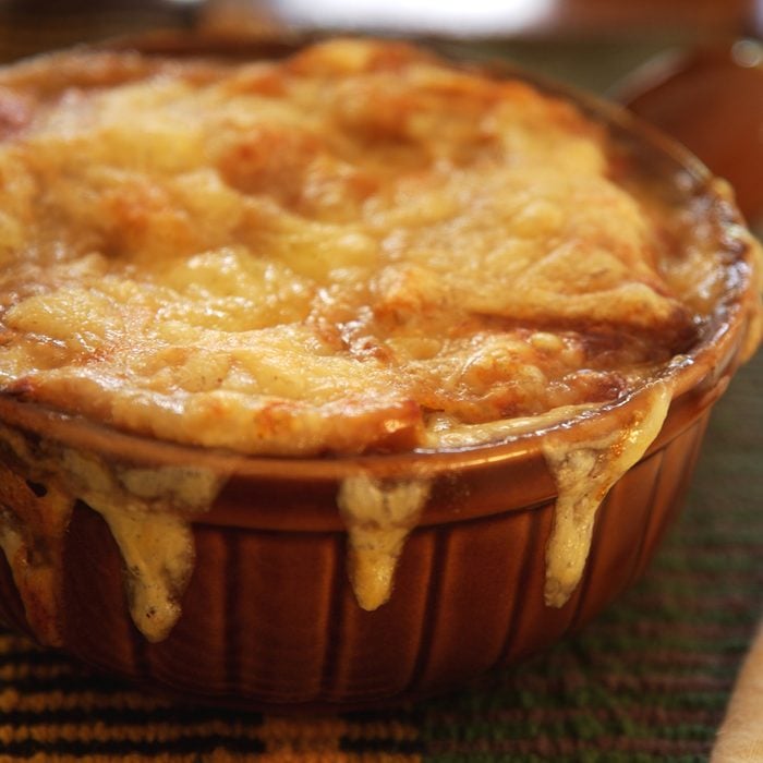 French onion soup, covered with melted cheese