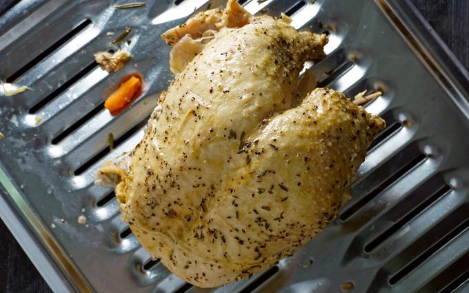 fully cooked instant pot turkey on a broiler pan ready to crisp the skin