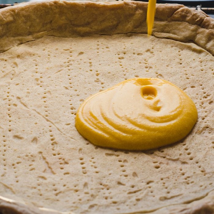 Pie crust filling with pumpink filling; Shutterstock ID 1433758553; Job (TFH, TOH, RD, BNB, CWM, CM): TOH