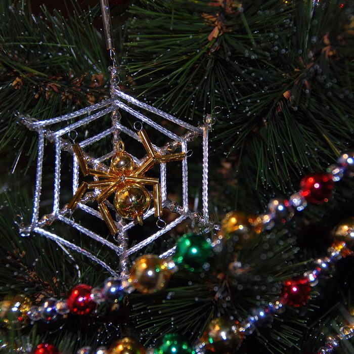 Pied bright shiny glass garland on the Christmas tree. 