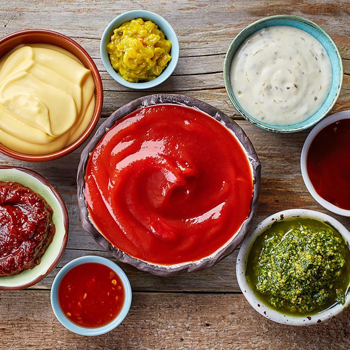 Different condiments in little containers