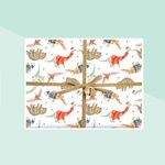 Christmas Wrapping Paper Featuring Cute Dinos In Christmas Sweaters