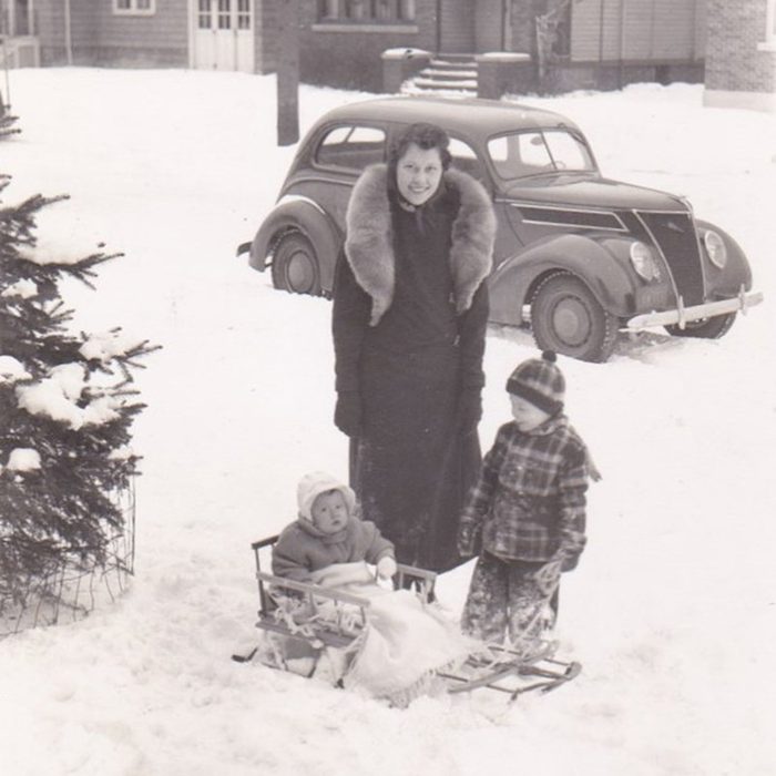 Family photo in snow-covered front yard