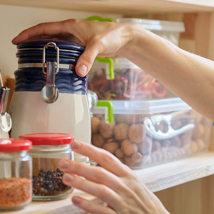 Woman in the kitchen with can of dry mint, food storage, pantry.; Shutterstock ID 1566195697; Job (TFH, TOH, RD, BNB, CWM, CM): TOH