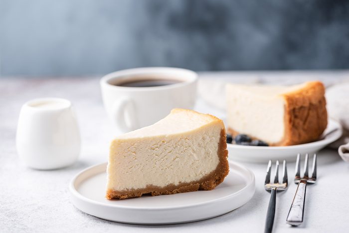 Classical New York Style Cheesecake And Coffee On Table