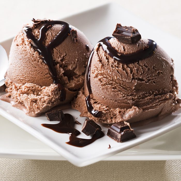 Chocolate ice cream with syrup close up