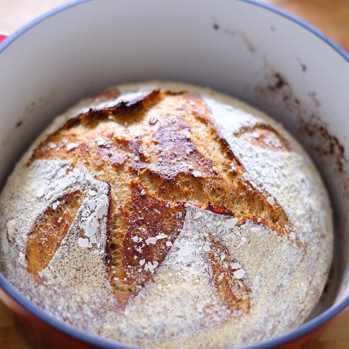 Close up of a freshly baked sourdough bread in a dutch oven