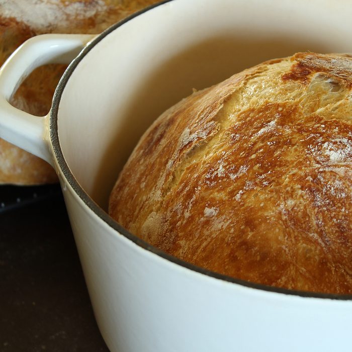Freshly baked artisan bread in dutch oven.