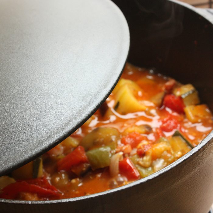 Ratatouille being cooked in a cast iron casserole Stewed dish French cooking