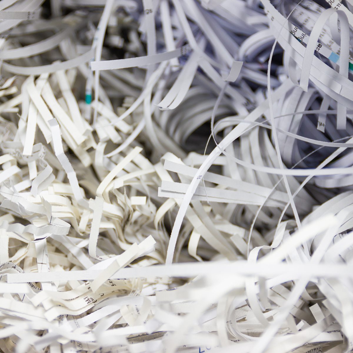Closeup confidential information Strips of destroyed paper from a paper shredder