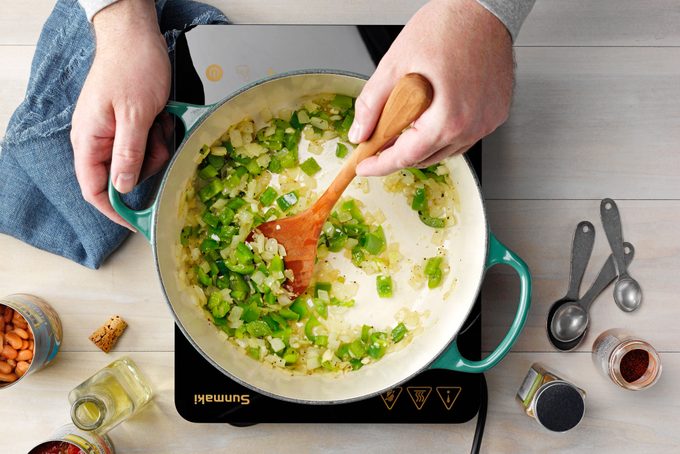 How to Make Vegan Chili featuring Taste of Home's Chunky Vegetarian Chili recipe; Step 1; Build a flavor base for the sauce in a Dutch oven