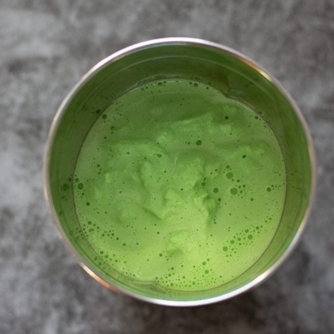 Green Shamrock Shake mixture in metal container.