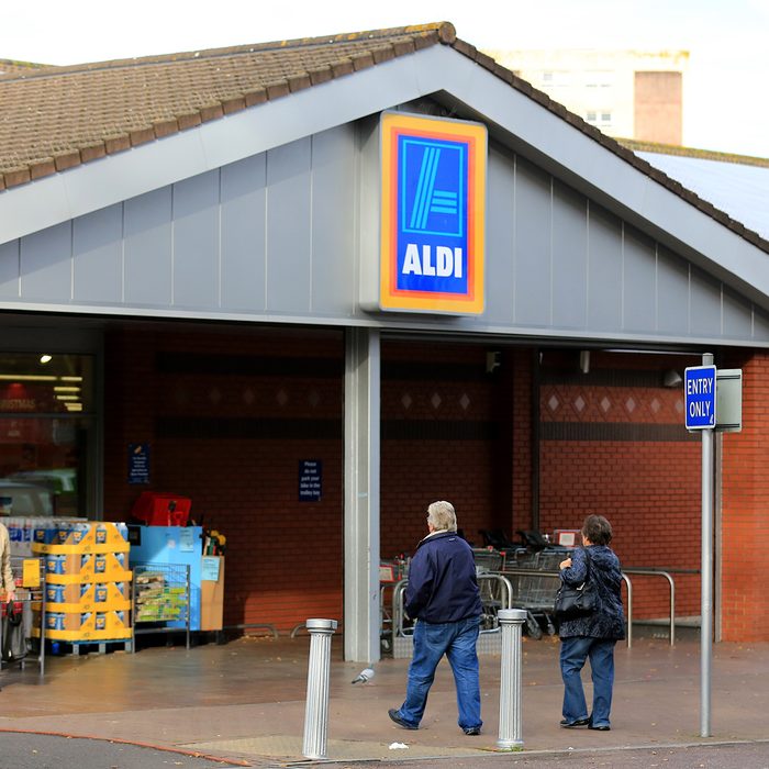 BRISTOL, ENGLAND - NOVEMBER 07: Shoppers enter a branch of the budget supermarket Aldi on November 7, 2013 in Bristol, England. As the German chain opens its 500th store in the affluent Bury St Edmunds, some retail experts are claiming that the low-cost supermarket is trying to attract more affluent shoppers, in particular by offering large discounts on luxury items. (Photo by Matt Cardy/Getty Images)