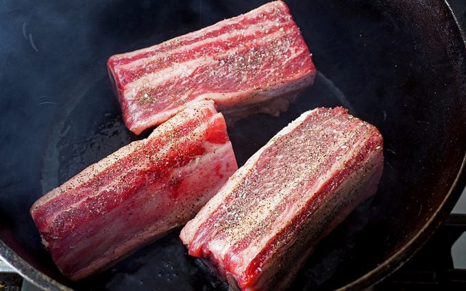 Short ribs being seared 1