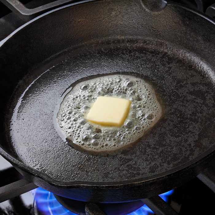 Skillet with butter melting in it.