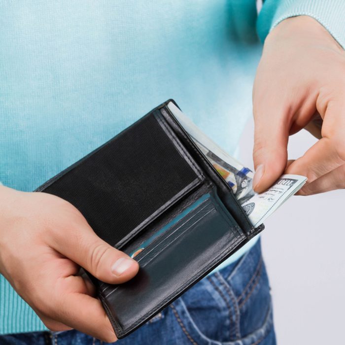 man holding a wallet with money; Shutterstock ID 532192255; job: Job (TFH, TOH, RD, BNB, CWM, CM)