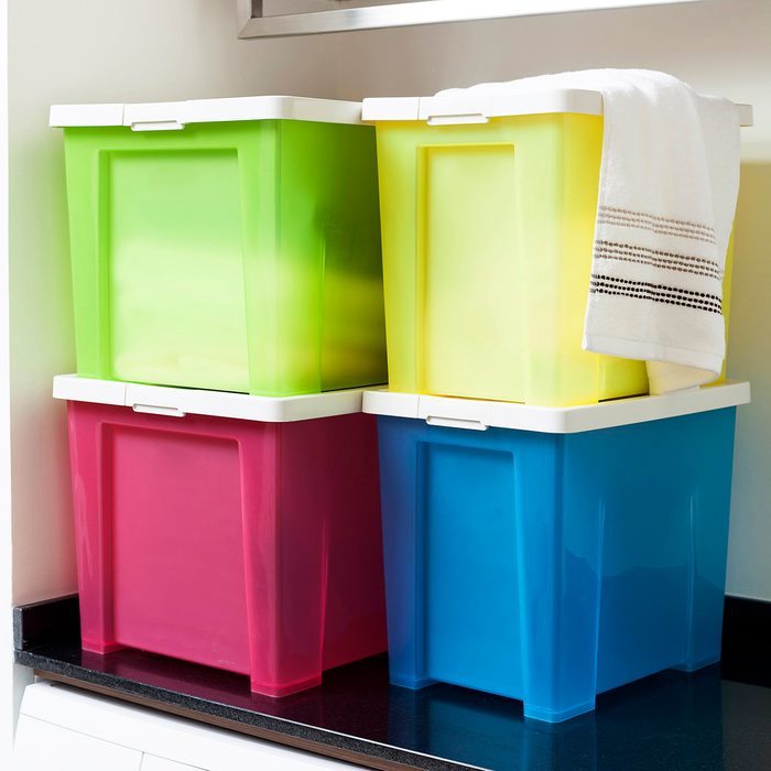 Colorful storage boxes on shelf