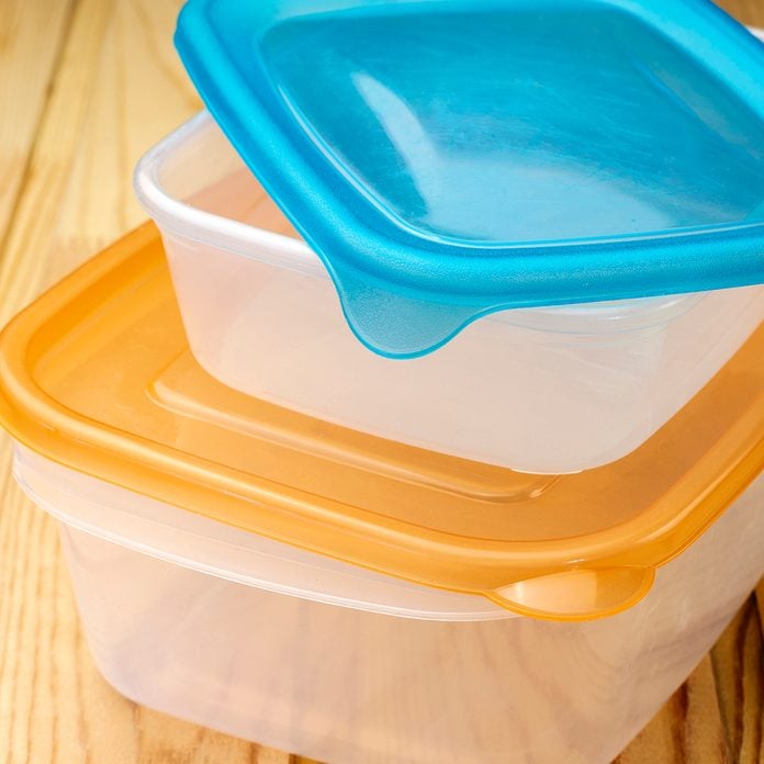 Plastic food containers on a wooden table