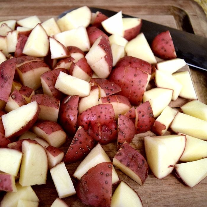 Cutting red potatoes for a potato salad