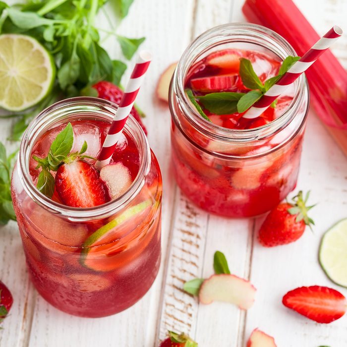 Preparation homemade refreshing strawberry,lime and rhubarb lemonade with mint