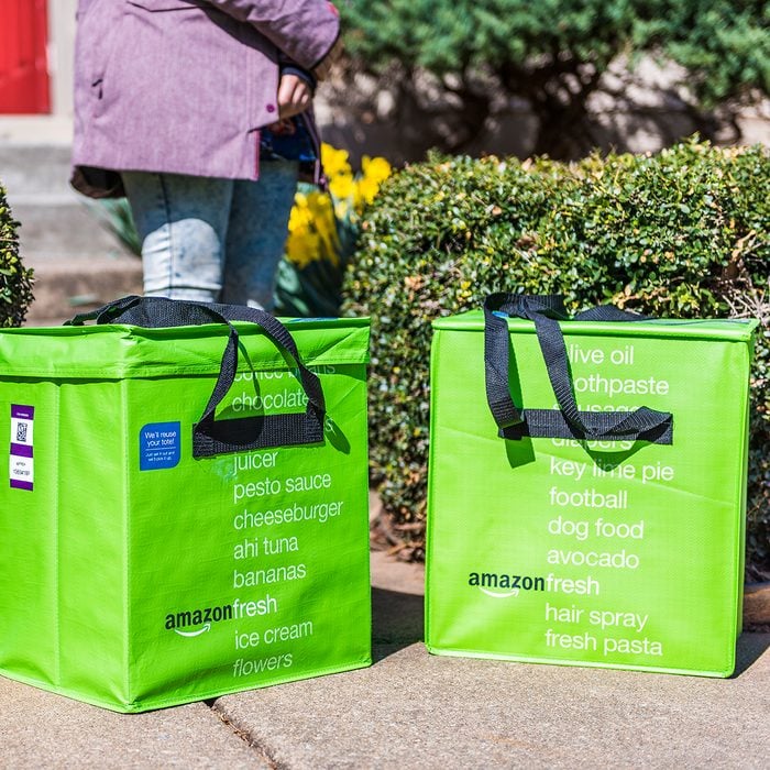 Amazon Fresh insulated grocery delivery bags on front porch closeup