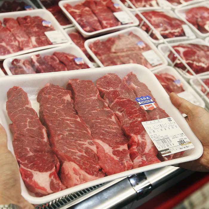 CHIBA, JAPAN - AUGUST 9: A customer looks at a U.S. beef product at a branch of U.S. owned supermarket Costco on August 9, 2006 in Chiba, Japan. The Japanese government lifted the ban on the import of U.S. beef on July 27, and the first shipment of cargo, which faced seperate inspections from both the Japanese Health Ministry and Agriculture Ministry, arrived on August 7. The ban had been in place since January 20, when inspectors found banned material in a shipment of veal from a U.S. supplier, just two months after lifting a previous two year import ban. (Photo by Koichi Kamoshida/Getty Images)