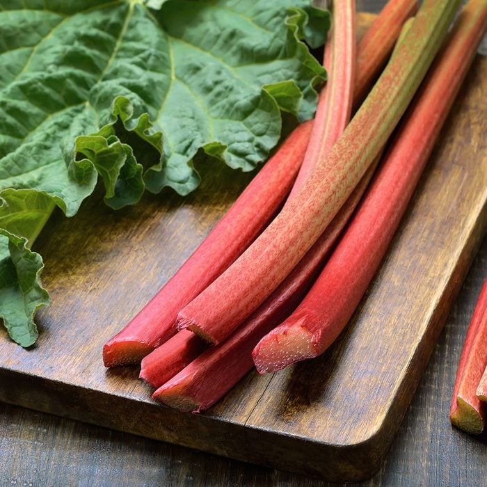 Fresh rhubarb on wooden board