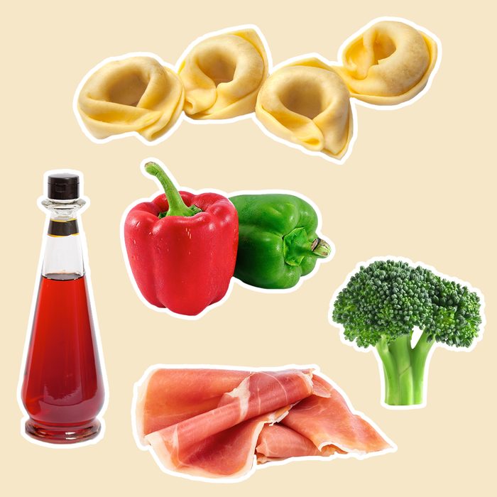 cheese tortellini with red wine vinaigrette, chopped red and green bell peppers, broccoli and sliced prosciutto