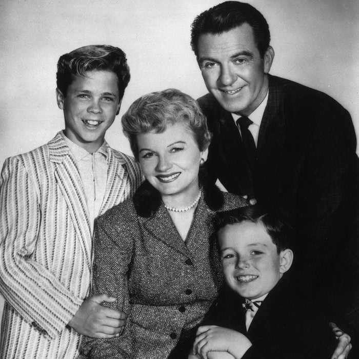 circa 1957: American actors (clockwise, from left) Tony Dow, Hugh Beaumont (1909 - 1982), Jerry Mathers, and Barbara Billingsley pose together in a promotional portrait for the television series, 'Leave It to Beaver'. (Photo by CBS Photo Archive/Getty Images)