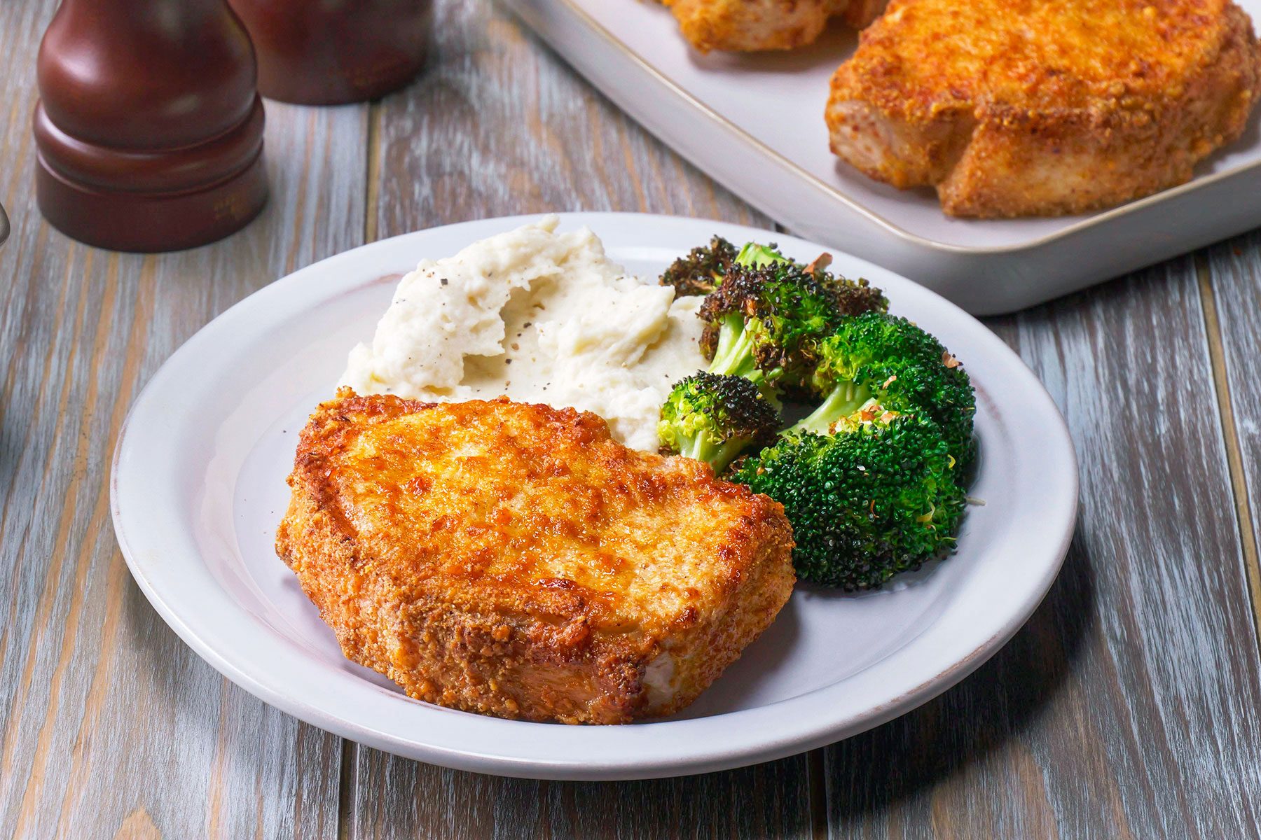 Pork Chops on Plate with Broccoli and Mashed Potato