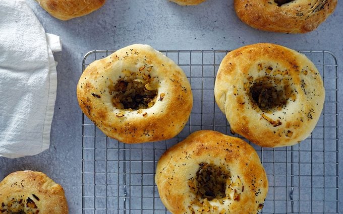 fresh baked bialys filled with caramelized onions and poppyseeds