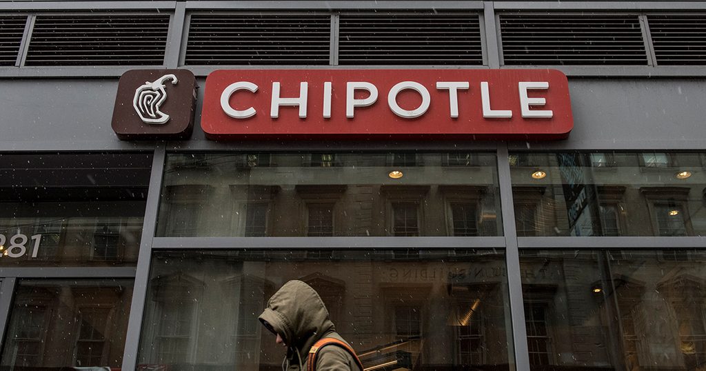 NEW YORK, NEW YORK -- FEBRUARY 8: A man walks past an empty Chipotle restaurant on Broadway in Lower Manhattan on February 8, 2016 in New York City. The Mexican food chain is closing stores for lunch nationwide for a meeting on food safety following a number of E. coli outbreaks. (Photo by Andrew Renneisen/Getty Images)