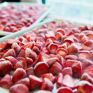 2 sheet pans full of frozen strawberries