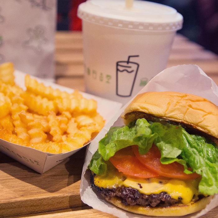 CHICAGO, IL - JANUARY 28: In this photo illustration a cheeseburger and french fries are served up at a Shake Shack restaurant on January 28, 2015 in Chicago, Illinois. The burger chain, with currently has 63 locations, is expected to go public this week with an IPO priced between $17 to $19 a share. The company will trade on the New York Stock Exchange under the ticker symbol SHAK. (Photo Illustration by Scott Olson/Getty Images)