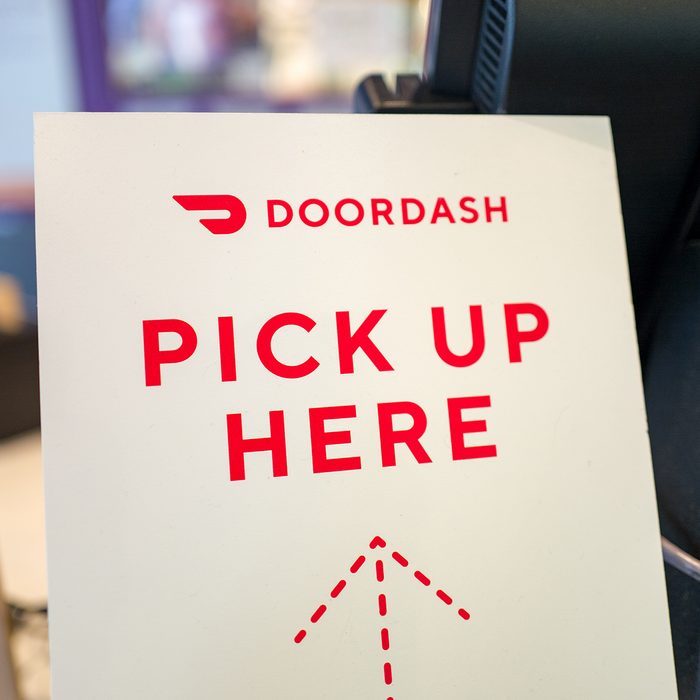 Close-up of sign for gig economy meal delivery app Doordash, with text reading Doordash Pick up Here, in a restaurant setting in Lafayette, California, May 23, 2019. (Photo by Smith Collection/Gado/Getty Images)